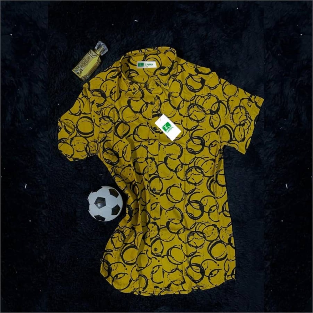 Dynamic Yellow and Black Short Sleeve Tee with Swirling Patterns